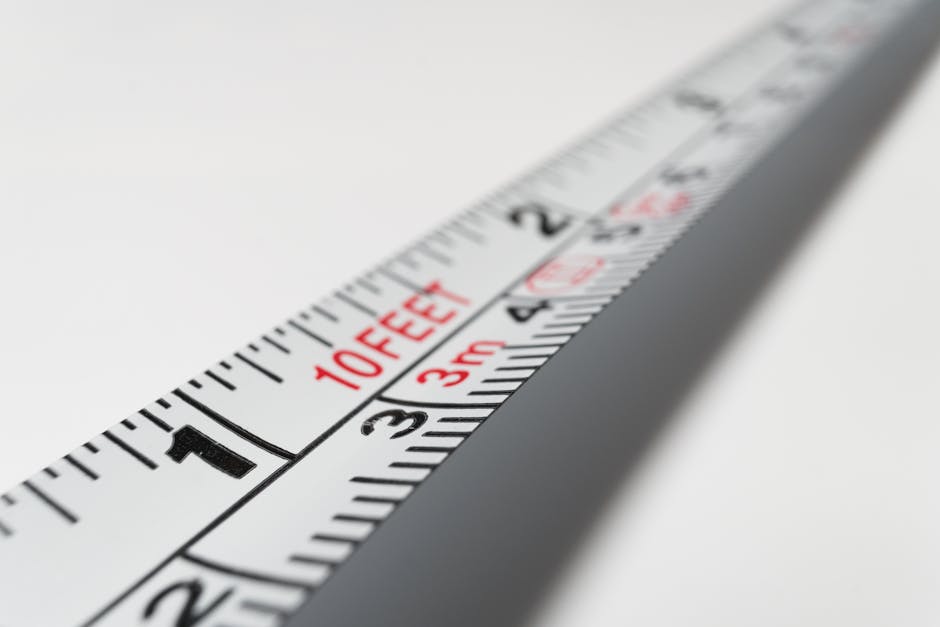 Detailed close-up of a measuring tape indicating measurements in feet and meters.